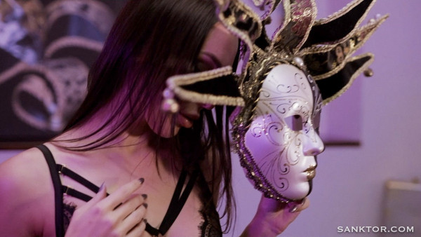 Hot striptease in a carnival mask